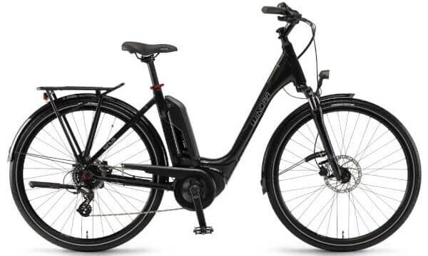 mujer en bicicleta eléctrica de alquiler, Megasportravel