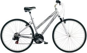 mujer en bicicleta de trekking, alquiler Megasportravel
